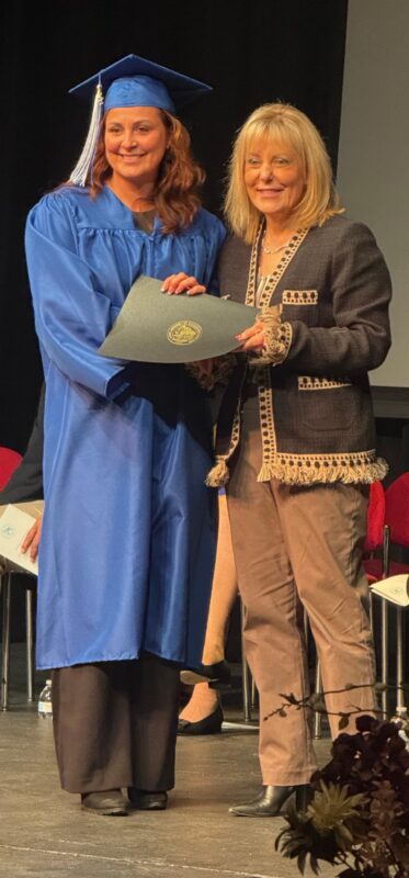 Maria Pineda receives her high school diploma at AACC.